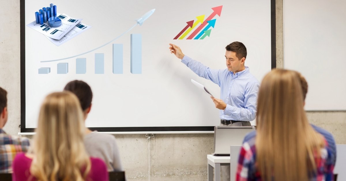 A Business man explaining the financial charts to his co-workers.